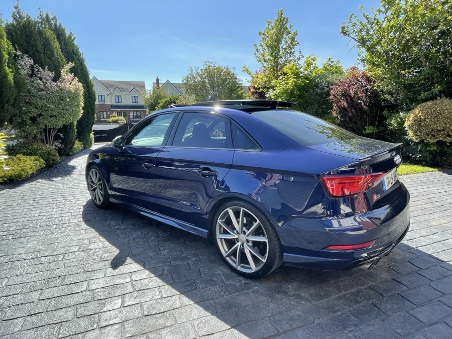 Rear three-quarter view of the same car